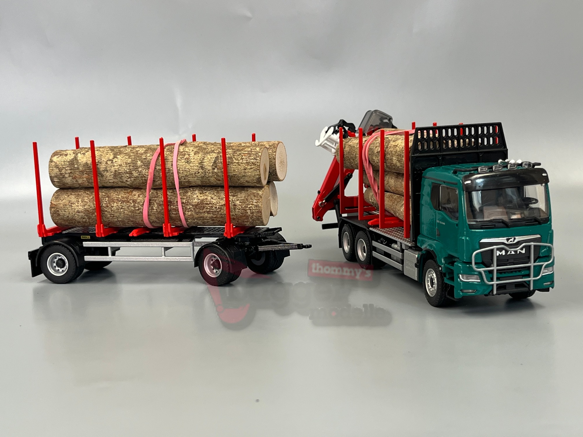 81233-2 -Conrad- MAN TGS TN mit Doll Kurzholzzug Epsilon QI7Z incl Masterdrive - blau