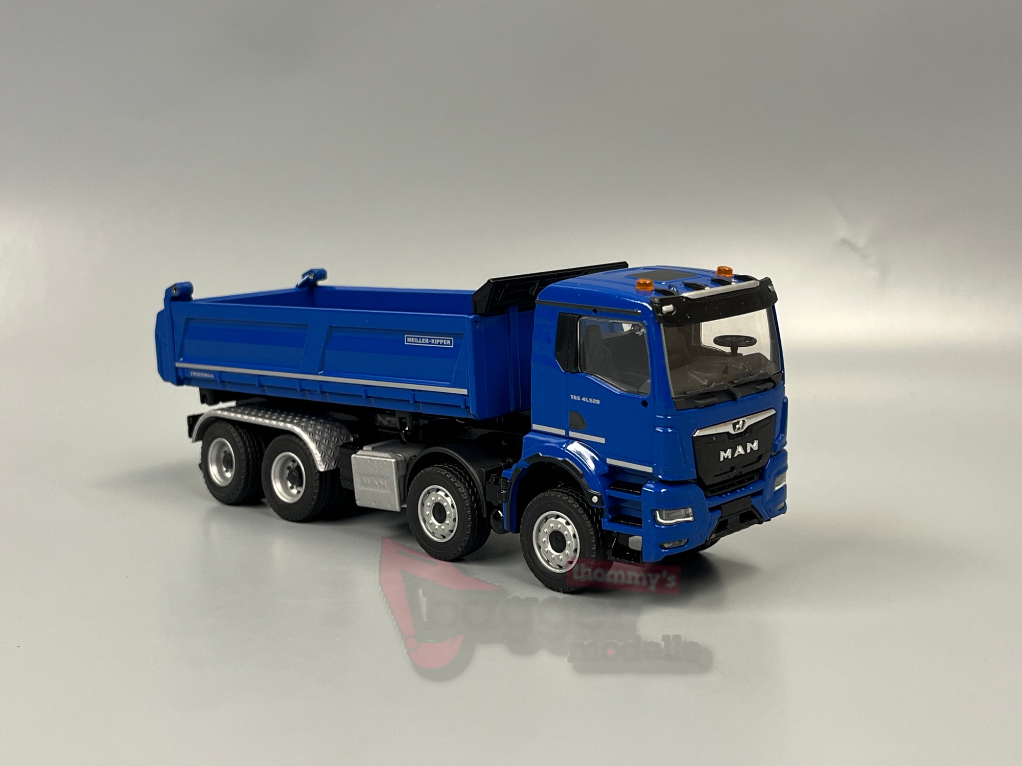 81255-5 - Conrad - MAN TGS NN 41.520 Meiller Trigenius Dreiseitenkipper blau