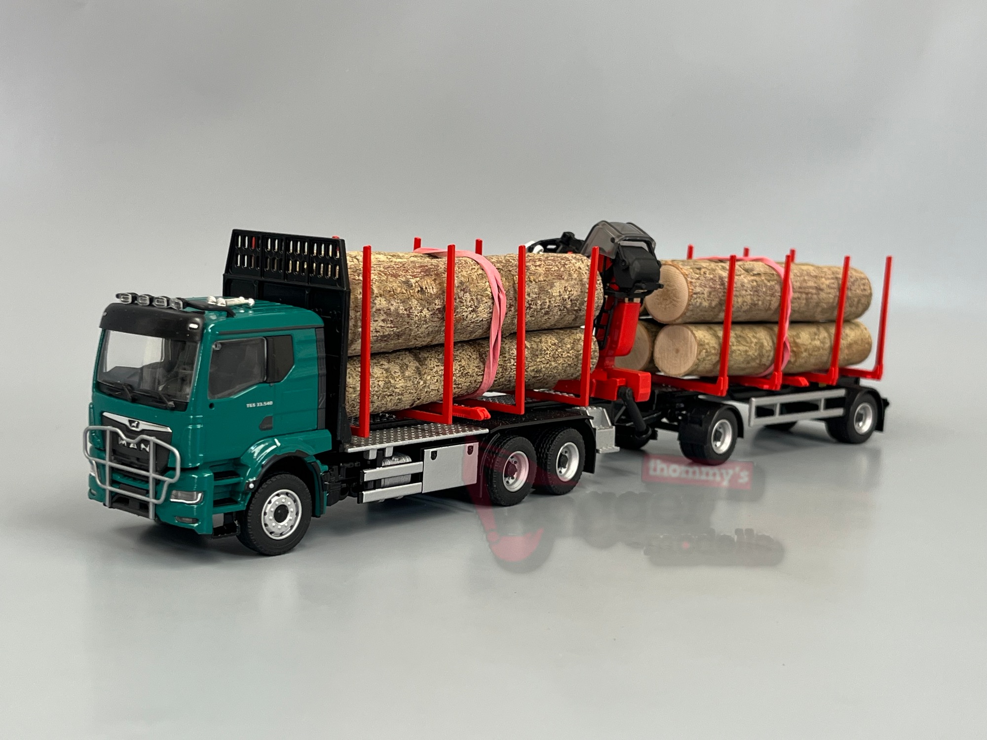 81233-2 -Conrad- MAN TGS TN mit Doll Kurzholzzug Epsilon QI7Z incl Masterdrive - blau