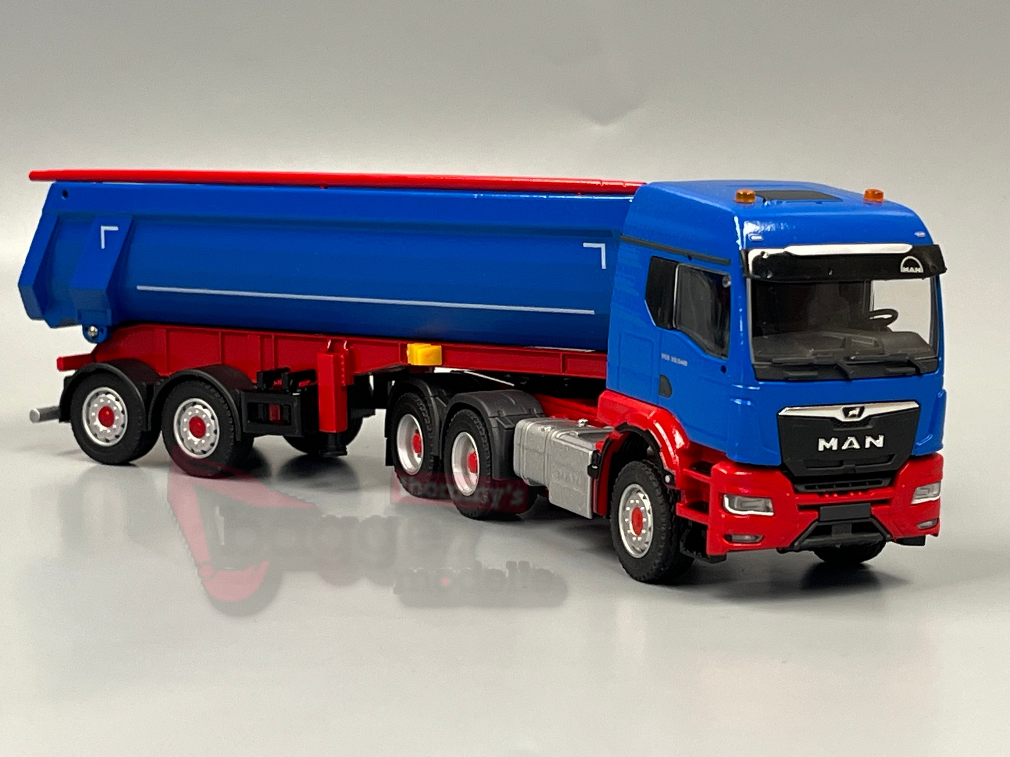 81265 - Conrad - MAN TGS TM 33.540 Schwarzmüller Kippsattelzug blau