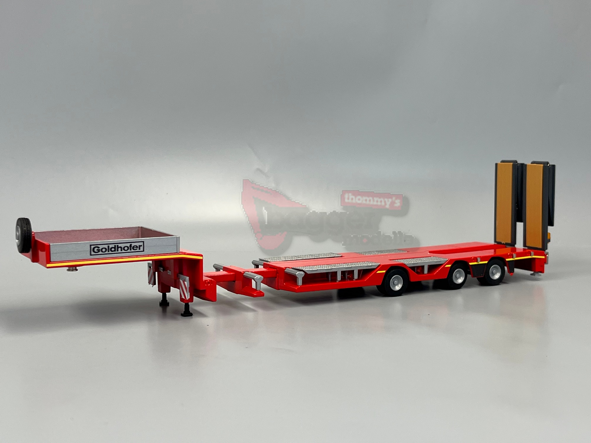98040/01 - Conrad - 3achs Goldhofer Stepstar Semi Auflieger mit Radmulden in rot