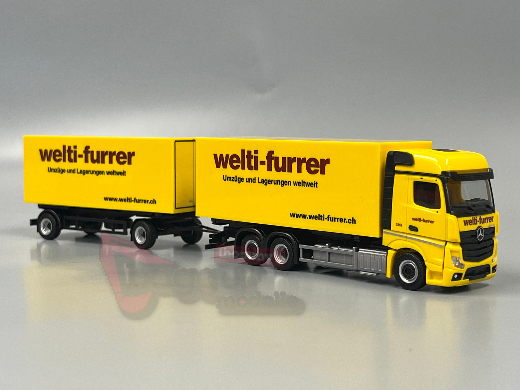 319355 - Herpa - Mercedes-Benz Actros Bigspace Wechselkoffer-Hängerzug "Welti-Furrer"