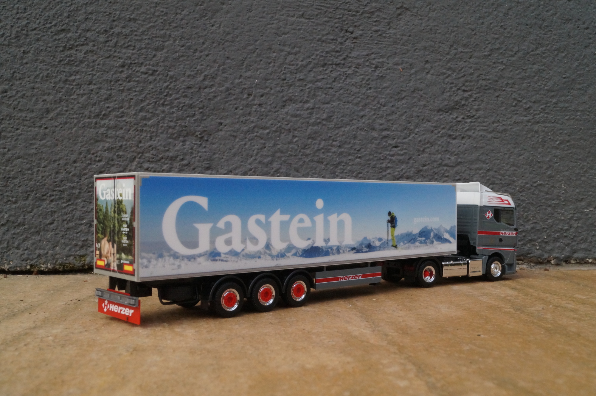 954822 - Herpa - MAN TGX GM Kühlkoffer Sattelzug " Herzer Gestein" AT