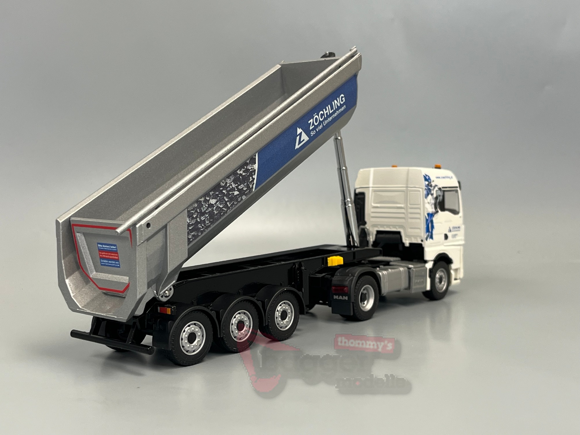 80231-4 - Conrad - MAN TGX GM Sattelzug mit SCHWARZMÜLLER Rundmulden Sattelkipper - Zöchling