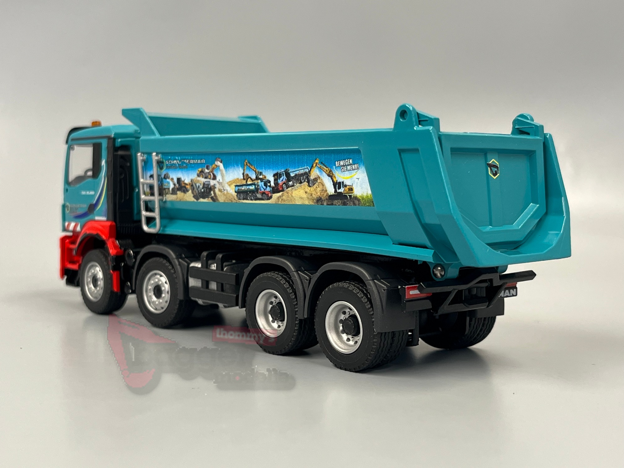 81215 - Conrad -  MAN TGS NN mit Carnehl Halbschalenmulde  -Schmuttermair
