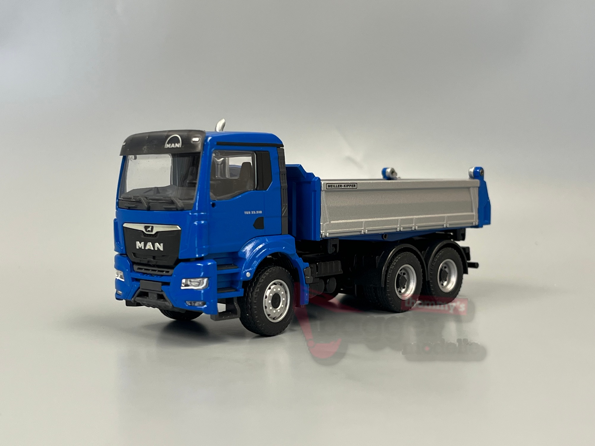 81181 -Conrad -MAN TGS NN 3achs mit Meiler Dreiseitenkipper blau silber